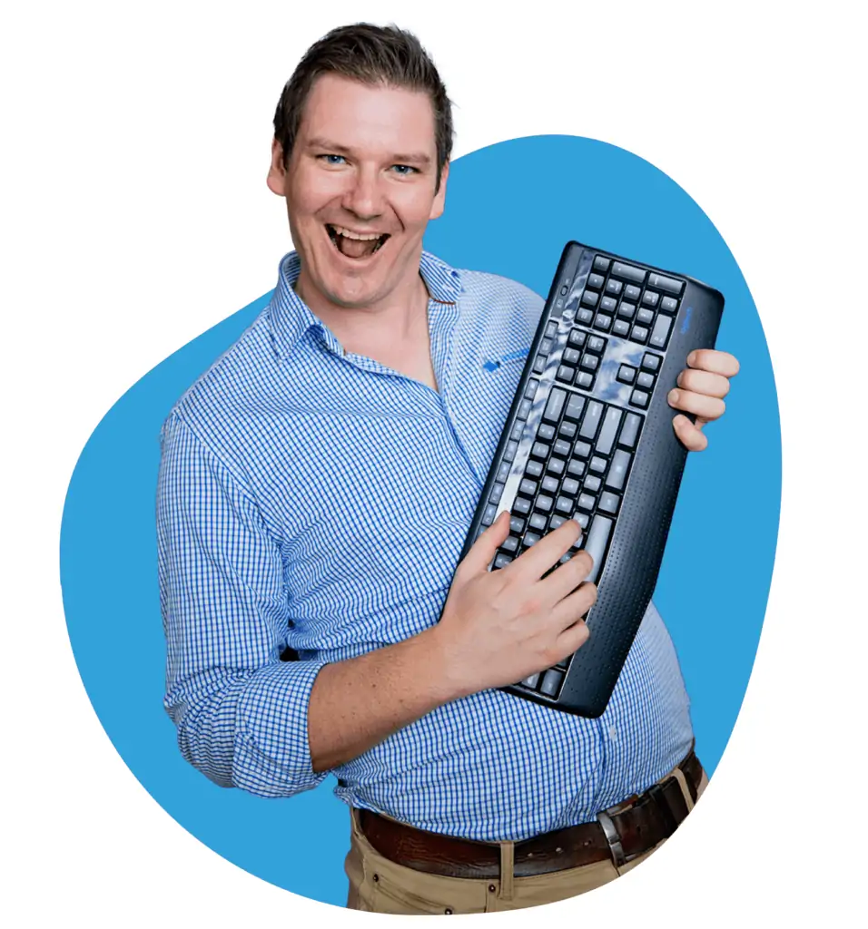 Chris Hurn, General Manager at Envisage Technology holding a keyboard like a guitar